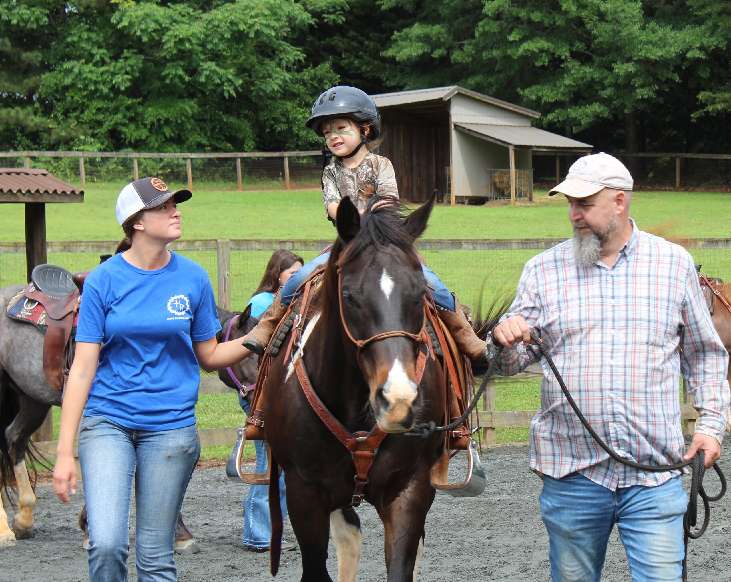 A Children's Cancer Partners child enjoys equine therapy.