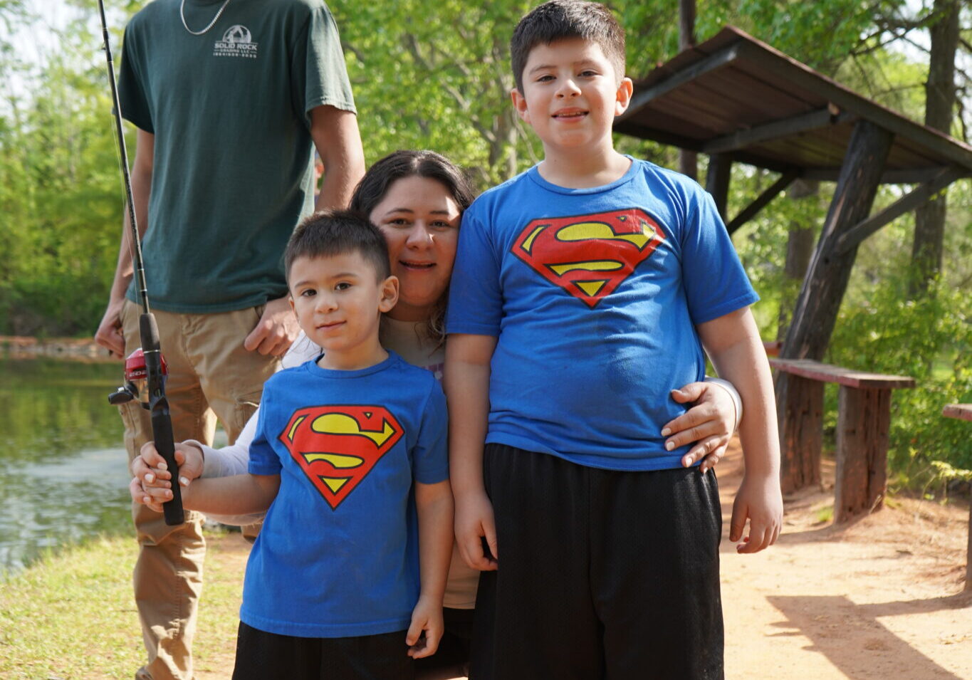 A CCP family learns how to fish at the Fishing Rodeo.